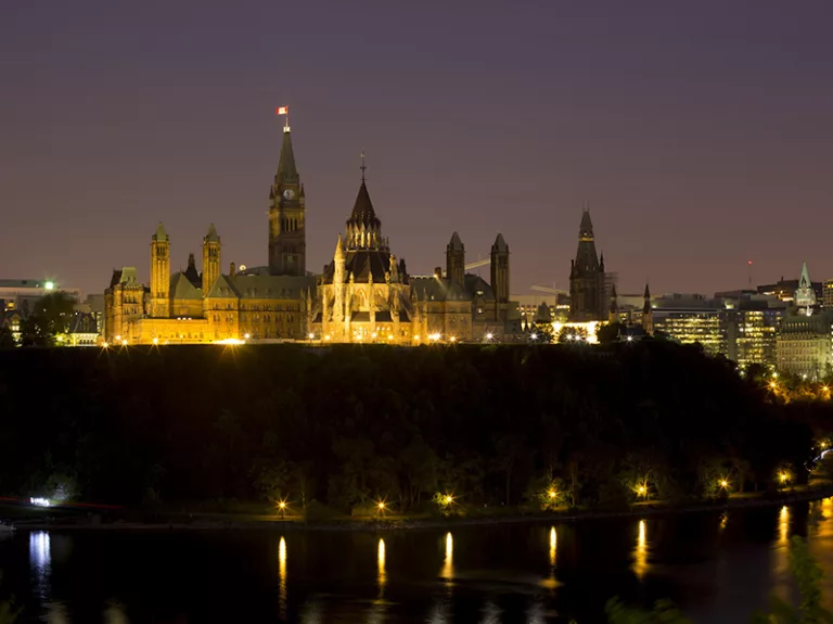 Buildings stand on Parliament Hill in Ottawa on Saturday July 6 2013.  Photographer: Brent Lewin/Bloomberg